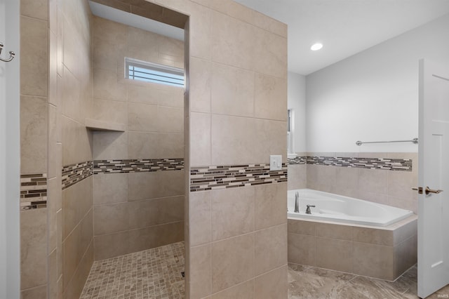 bathroom featuring plus walk in shower