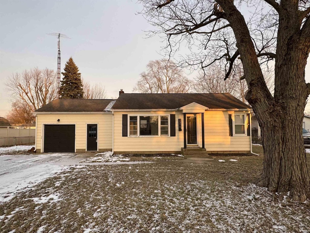 single story home featuring a garage