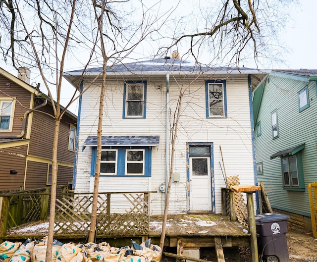 rear view of property with a wooden deck