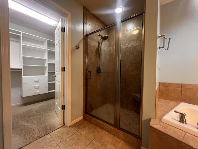 bathroom with tile patterned floors and plus walk in shower