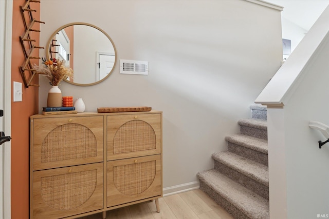 staircase featuring hardwood / wood-style flooring