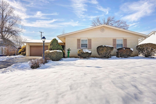 ranch-style house featuring a garage