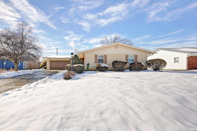 ranch-style house featuring a garage