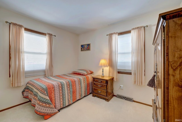 bedroom featuring light colored carpet