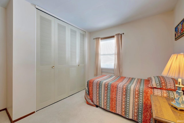 carpeted bedroom with a closet