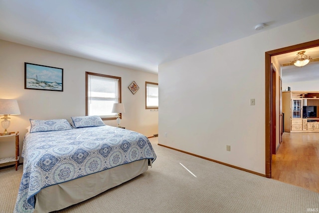 bedroom with light colored carpet