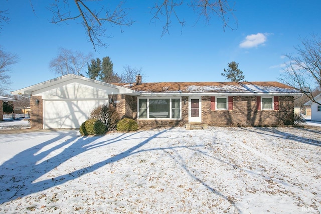 single story home featuring a garage