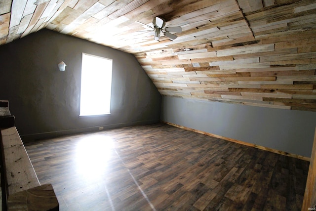 bonus room with vaulted ceiling and dark hardwood / wood-style floors