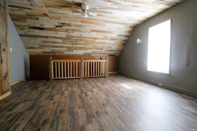 bonus room with ceiling fan, dark hardwood / wood-style flooring, vaulted ceiling, and wooden ceiling