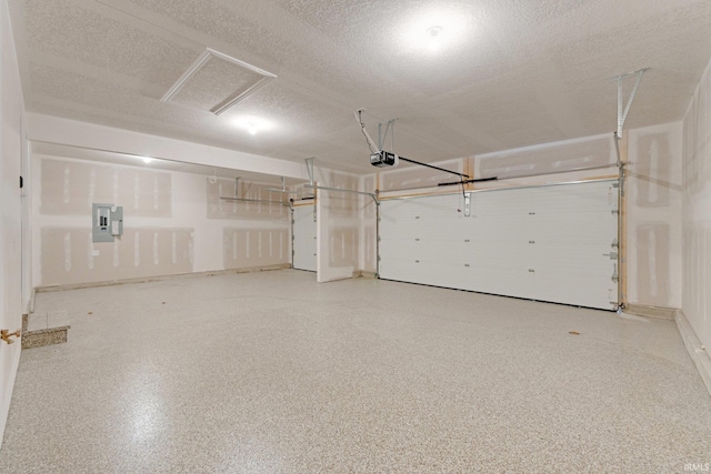 garage featuring a garage door opener and electric panel