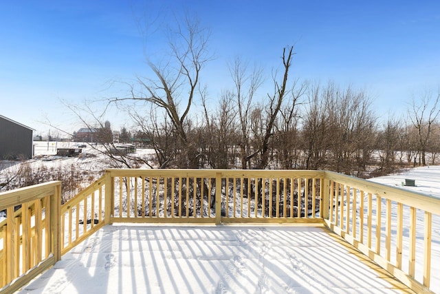 view of snow covered deck