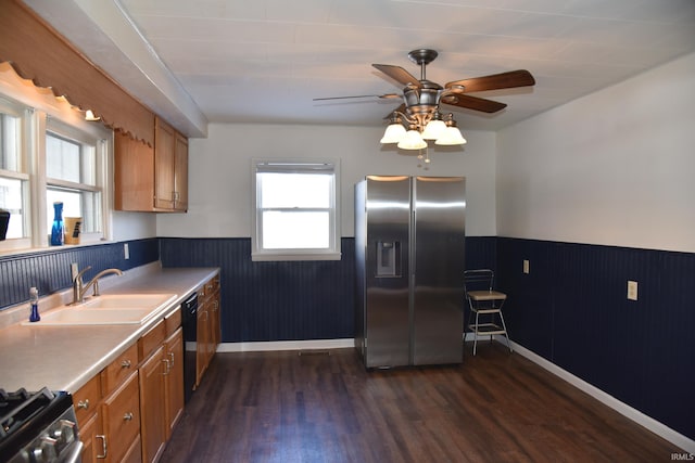 kitchen featuring dark wood-type flooring, ceiling fan, stainless steel appliances, and sink