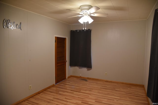 unfurnished bedroom featuring ornamental molding, ceiling fan, and light hardwood / wood-style floors