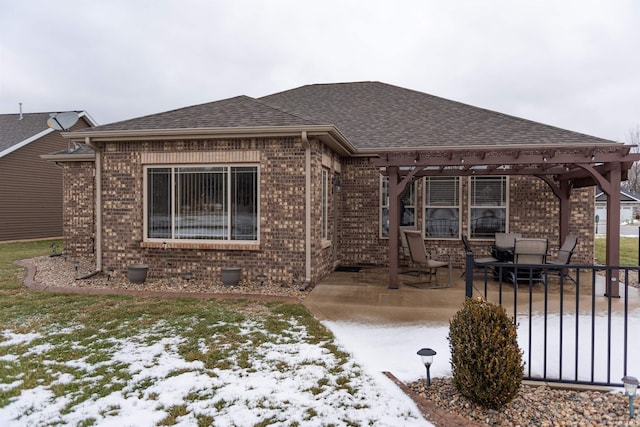 view of front of property with a patio and a pergola