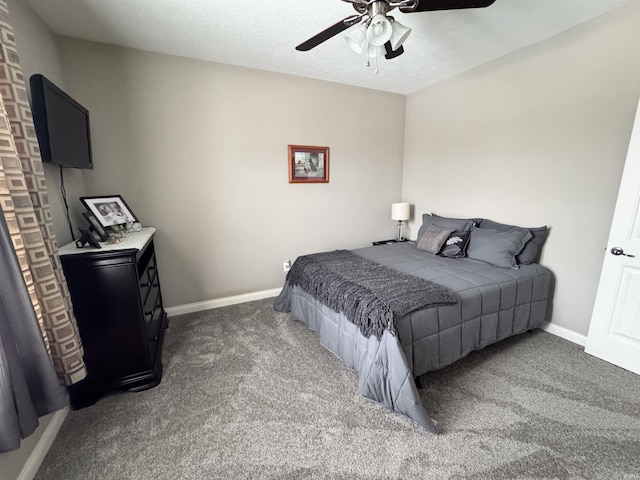 bedroom featuring ceiling fan and dark colored carpet