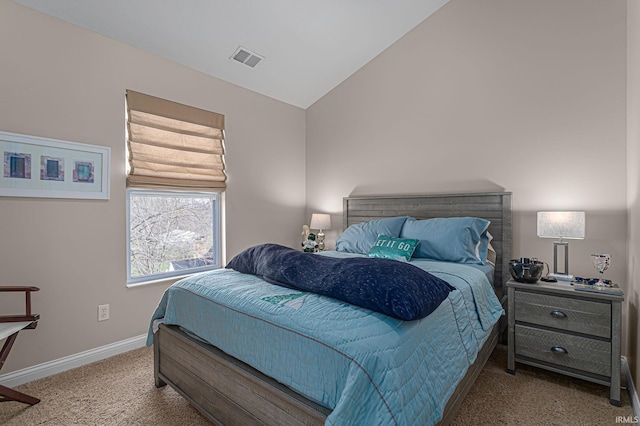 carpeted bedroom featuring vaulted ceiling