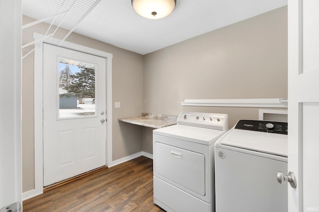 clothes washing area featuring separate washer and dryer and dark wood-type flooring