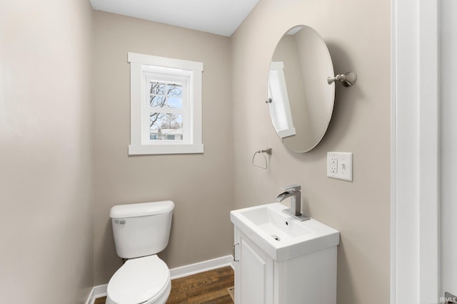 bathroom with vanity, hardwood / wood-style floors, and toilet