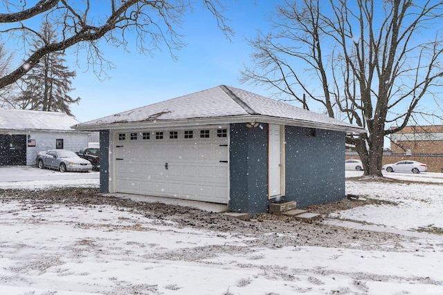 view of snow covered garage