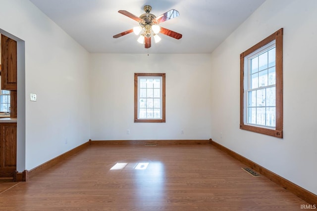 unfurnished room featuring ceiling fan and light hardwood / wood-style floors