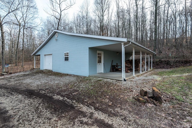 view of home's exterior featuring a garage and covered porch