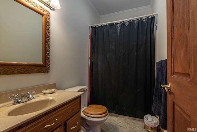 bathroom featuring ornamental molding, toilet, and vanity