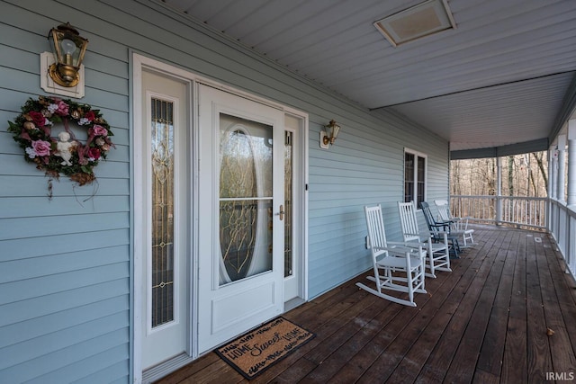 wooden terrace featuring a porch