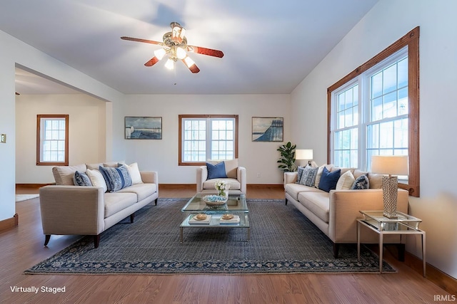 living room featuring hardwood / wood-style flooring and ceiling fan