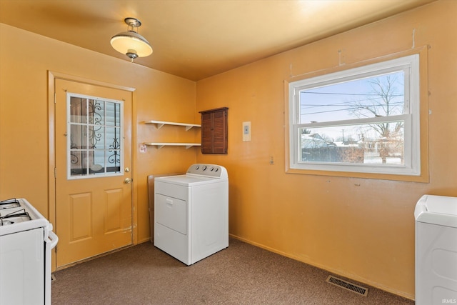 laundry room featuring carpet floors and washing machine and clothes dryer