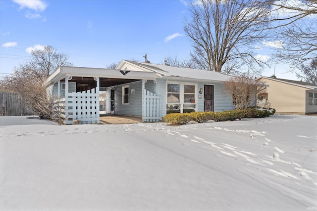 ranch-style home with a carport