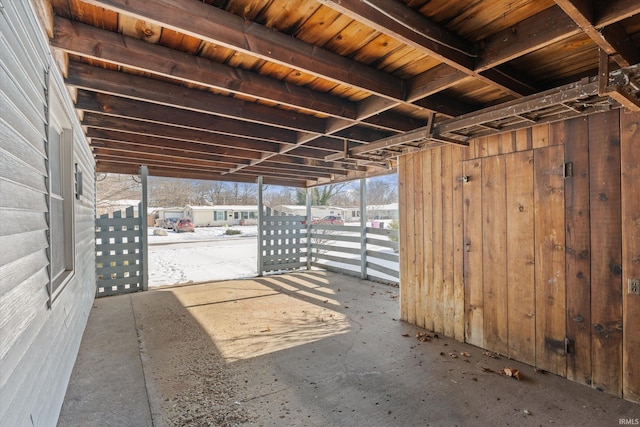 miscellaneous room featuring wooden walls