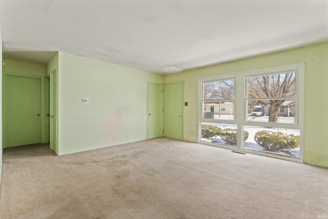 spare room with light colored carpet