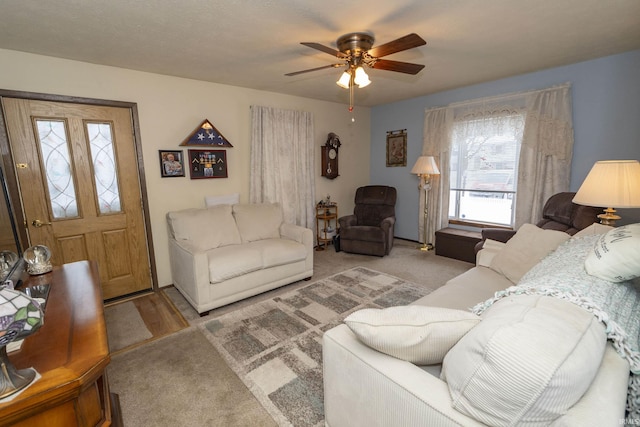 living room with light colored carpet and ceiling fan