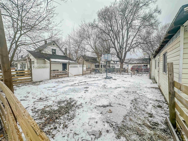 view of yard layered in snow