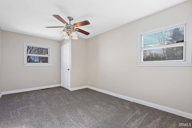 carpeted empty room with ceiling fan