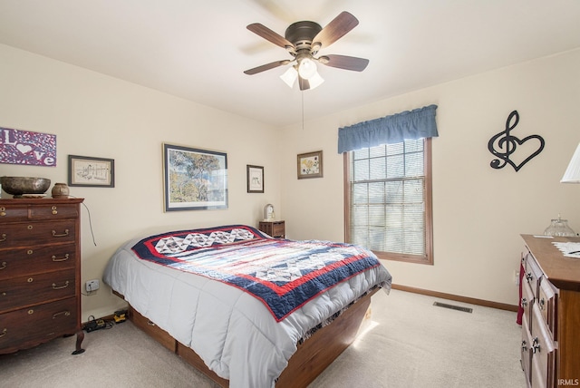 bedroom featuring ceiling fan and light colored carpet