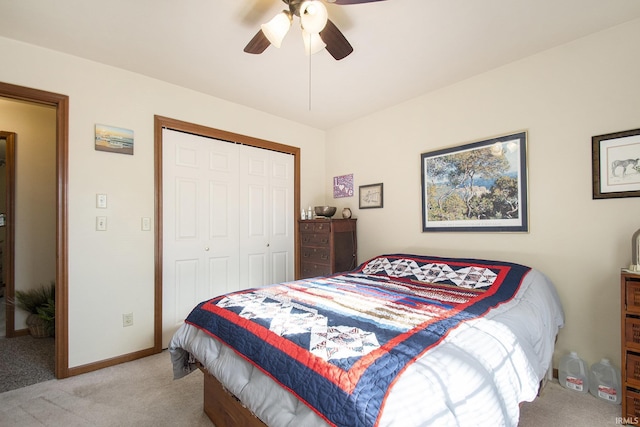 carpeted bedroom with ceiling fan and a closet