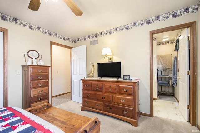 bedroom featuring light carpet and ceiling fan