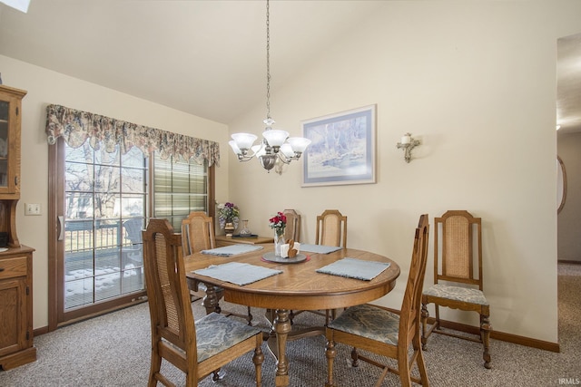 carpeted dining space with a notable chandelier and vaulted ceiling