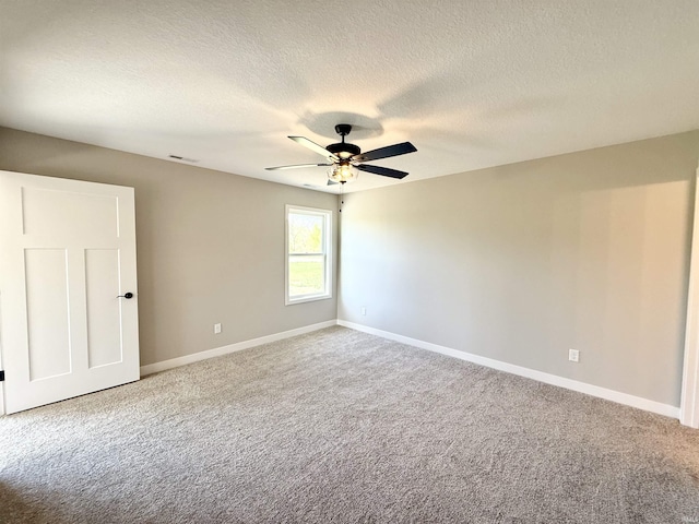 2360 Serenity Ct, Auburn, IN 46706 - carpeted spare room featuring ceiling fan, a textured ceiling, and baseboards