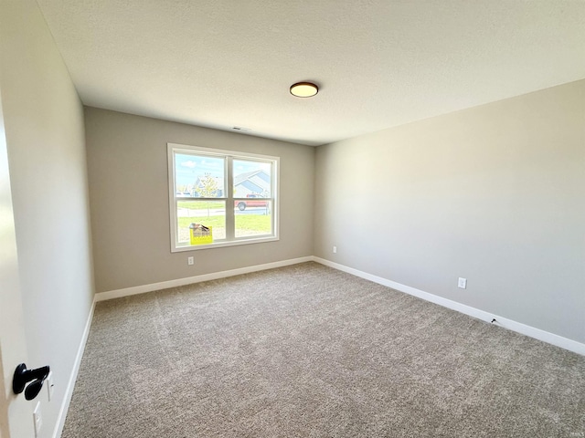 2360 Serenity Ct, Auburn, IN 46706 - unfurnished room with carpet flooring, baseboards, and a textured ceiling