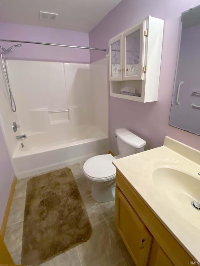 full bathroom featuring shower / tub combination, vanity, toilet, and tile patterned flooring