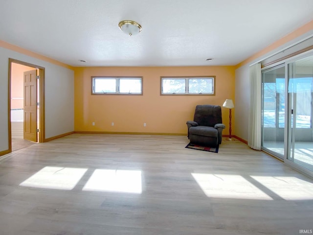 unfurnished room with light hardwood / wood-style flooring