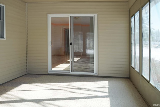 unfurnished sunroom with a wealth of natural light