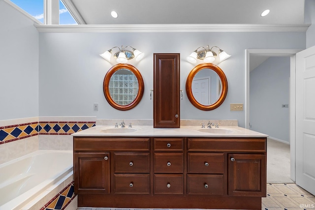 bathroom with crown molding, tiled bath, and vanity