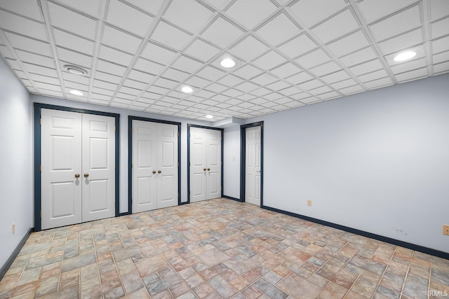 3072 Hamilton St, West Lafayette, IN 47906 - unfurnished bedroom featuring baseboards, recessed lighting, two closets, and stone finish flooring