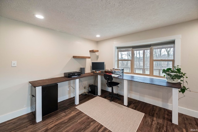 office featuring dark hardwood / wood-style floors and a textured ceiling