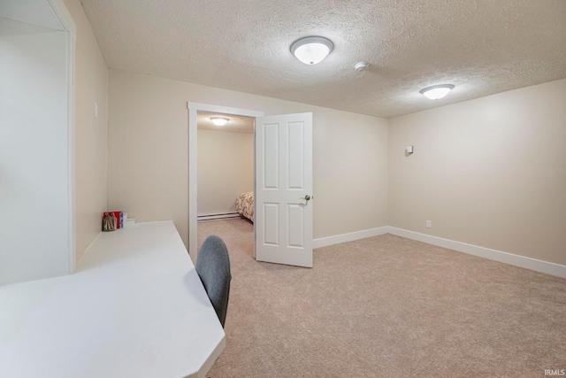 carpeted home office with a textured ceiling