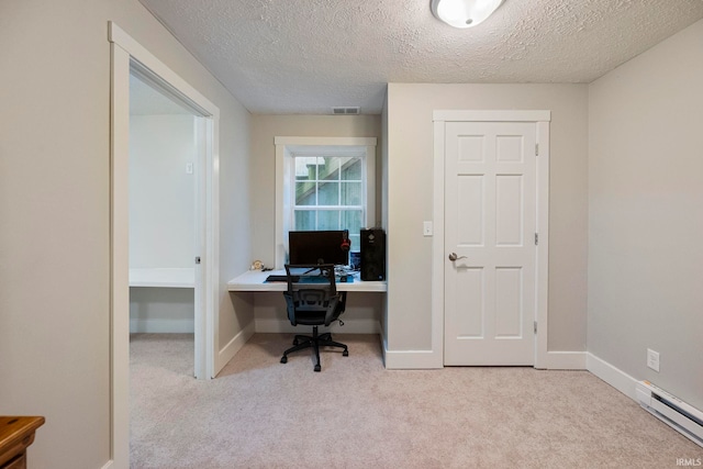 office featuring a baseboard radiator, light carpet, and a textured ceiling