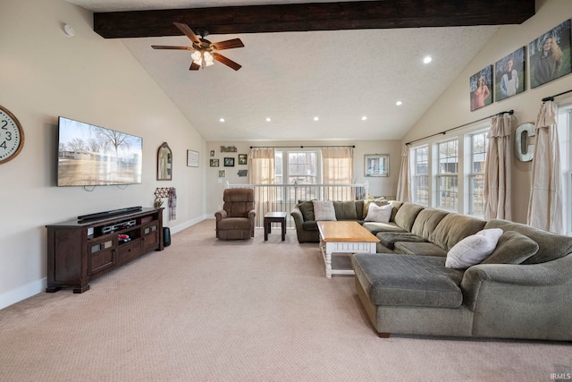 living room with light carpet, beam ceiling, high vaulted ceiling, and ceiling fan